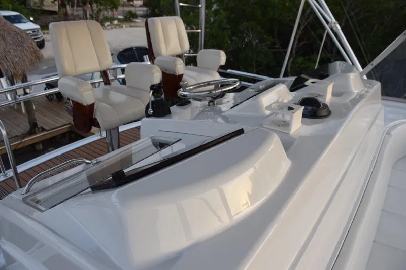 Main One Yacht Photos Pics Helm station of 2000 Custom Carolina Wetsig Yachts Cape Fear with captain's chairs.