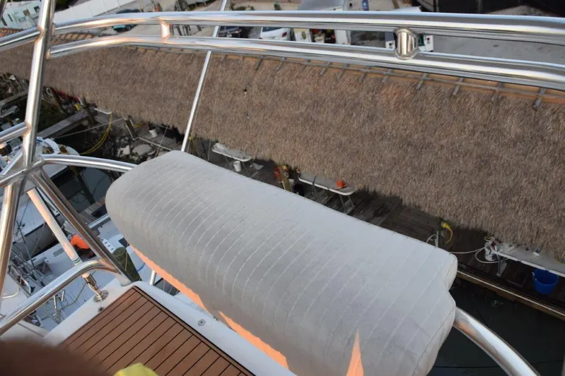 Main One Yacht Photos Pics Custom Carolina Wetsig Yachts Cape Fear 2000 boat deck with cushioned seating and railing.