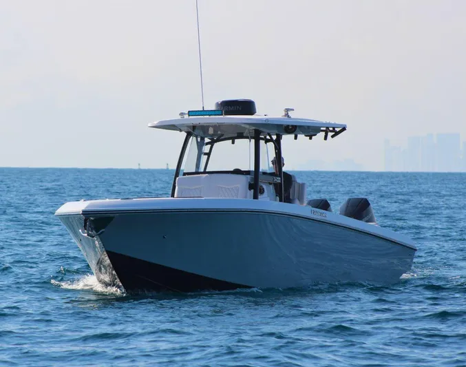  Yacht Photos Pics 2025 Fountain 34 CC boat cruising on open water.