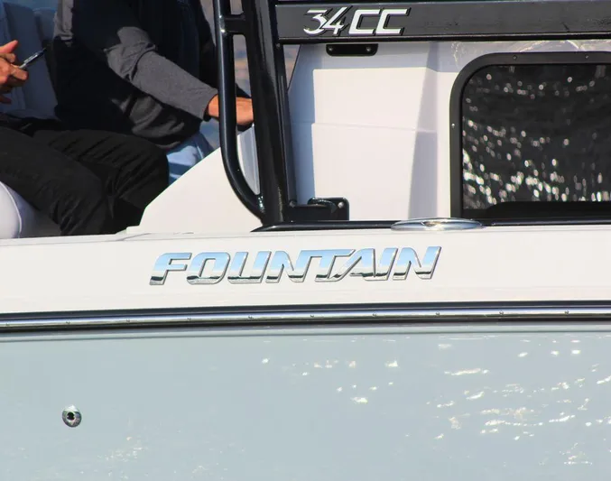  Yacht Photos Pics 2025 Fountain 34 CC boat side view with logo and model name.