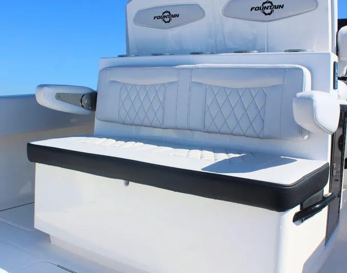  Yacht Photos Pics 2025 Fountain 34 CC boat seating with white upholstery and diamond stitching.