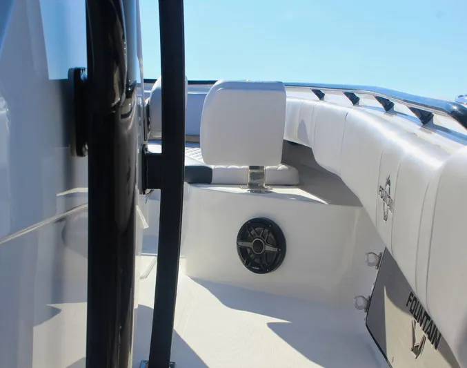  Yacht Photos Pics 2025 Fountain 34 CC boat interior with white seating and speaker, showcasing modern design.