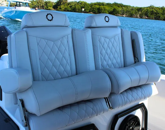  Yacht Photos Pics Luxury seating on 2025 Fountain 34 CC boat, featuring diamond-stitched upholstery.