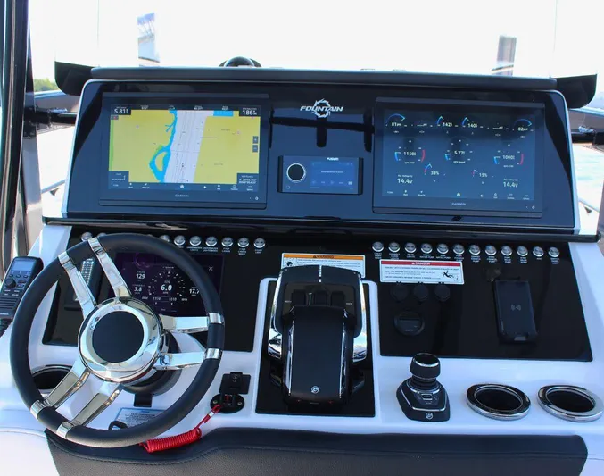  Yacht Photos Pics 2025 Fountain 34 CC boat dashboard with navigation and control systems.