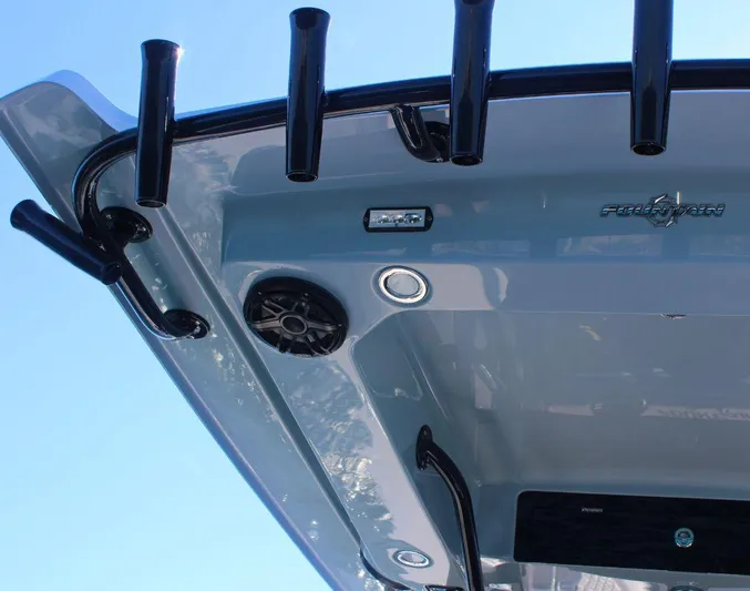  Yacht Photos Pics 2025 Fountain 34 CC boat, featuring rod holders and speakers on the deck.