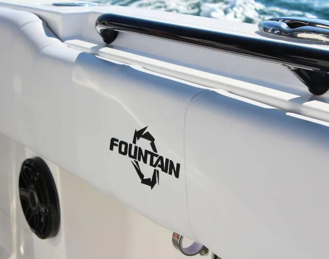  Yacht Photos Pics 2025 Fountain 34 CC boat detail with logo and railing.
