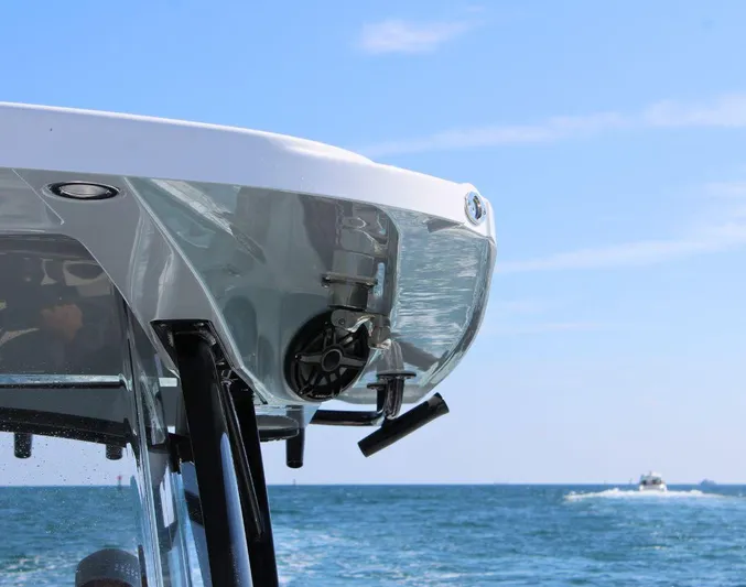  Yacht Photos Pics 2025 Fountain 34 CC boat on ocean, partial view, clear sky background.