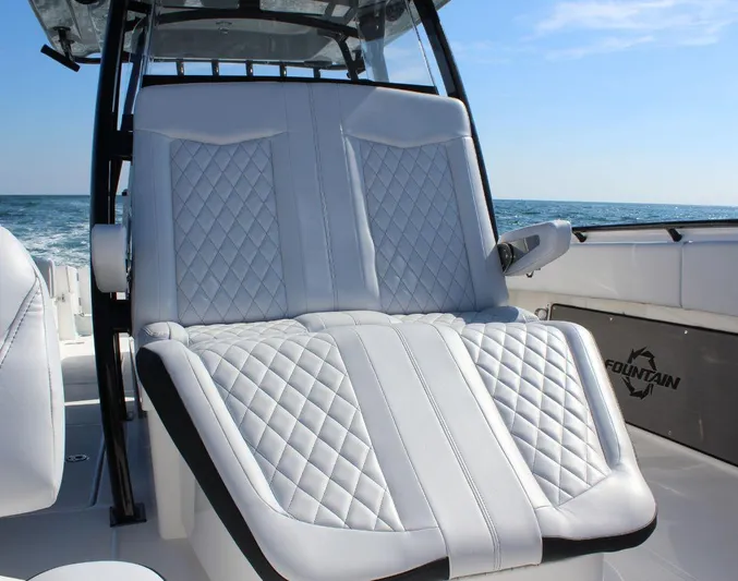  Yacht Photos Pics 2025 Fountain 34 CC boat with luxurious white quilted seating.