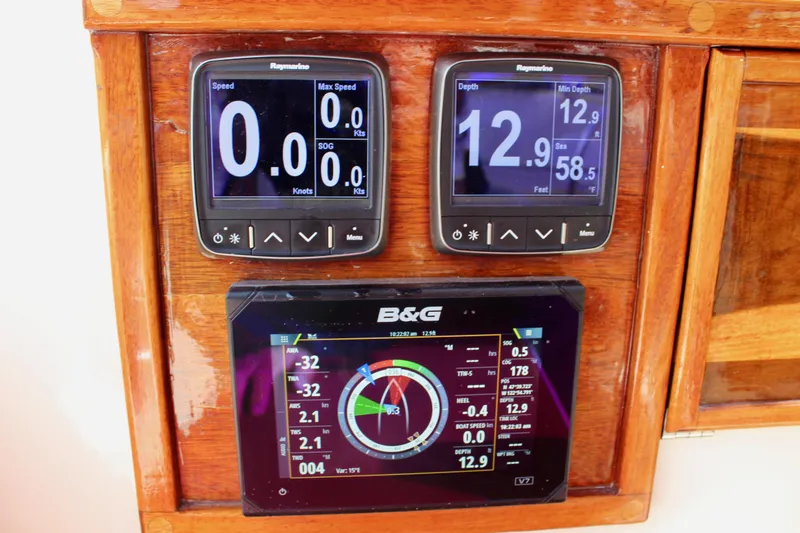 Phoenix Rising Yacht Photos Pics Navigation instruments on a 1981 Skookum 53 yacht dashboard, displaying speed and depth data.