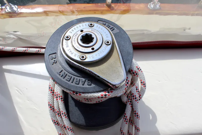 Phoenix Rising Yacht Photos Pics Winch on 1981 Skookum 53 sailboat with rope wrapped around it.
