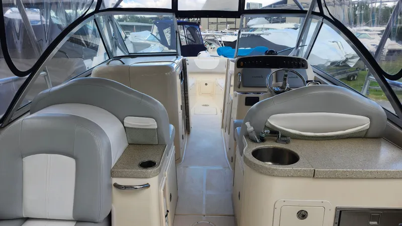  Yacht Photos Pics 2012 Grady-White Freedom 307 boat interior with helm, seating, and sink.