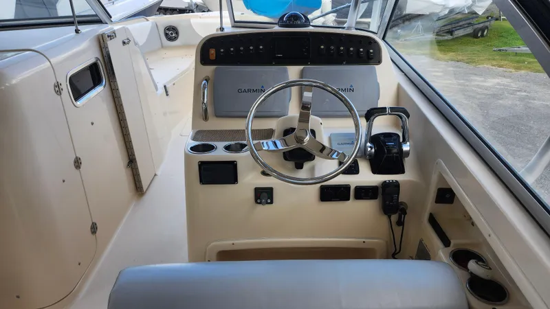  Yacht Photos Pics 2012 Grady-White Freedom 307 boat cockpit with Garmin navigation system.