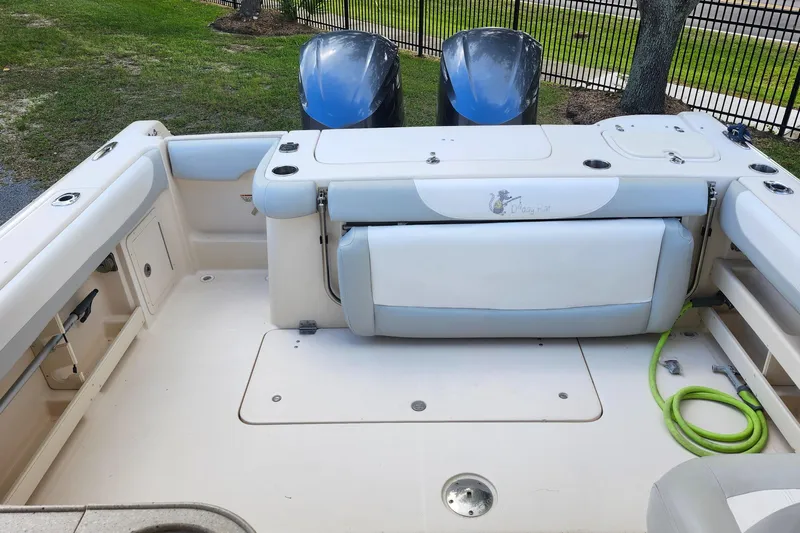  Yacht Photos Pics 2012 Grady-White Freedom 307 boat interior with seating and twin engines.