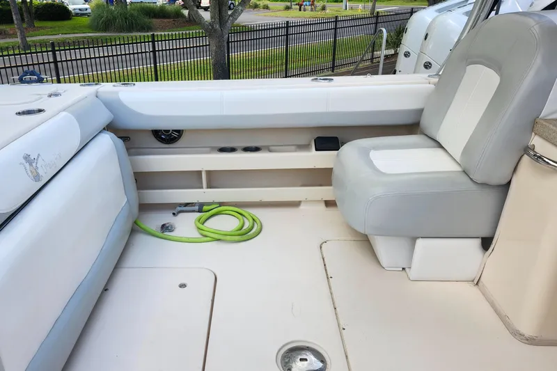  Yacht Photos Pics 2012 Grady-White Freedom 307 boat interior with seating and storage area.