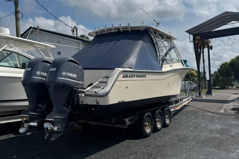  Yacht Photos Pics 2012 Grady-White Freedom 307 boat with dual Yamaha engines on a trailer.