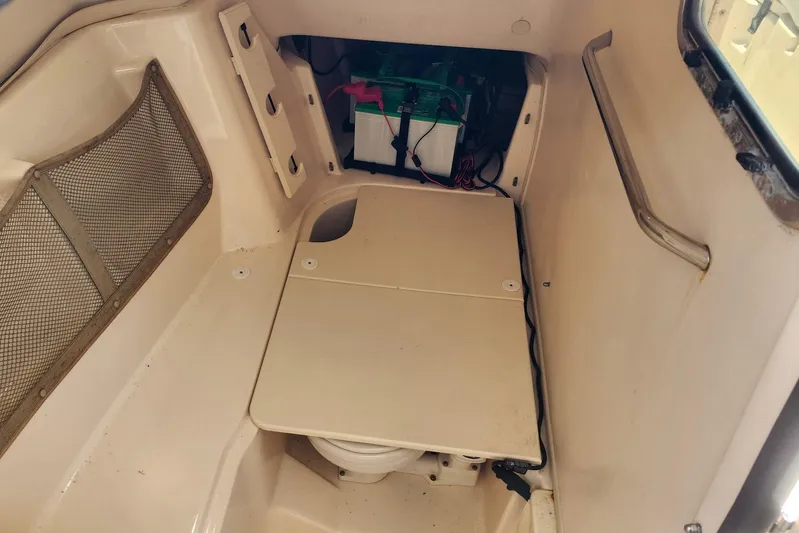  Yacht Photos Pics Interior of 2012 Grady-White Freedom 307 boat, featuring storage and battery compartment.