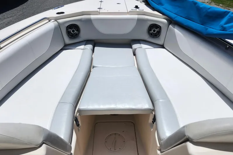  Yacht Photos Pics 2012 Grady-White Freedom 307 boat interior with cushioned seating and speakers.