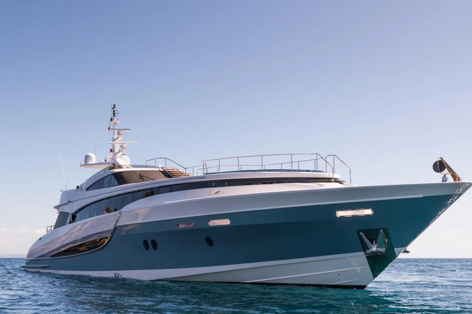 Luxurious 2005 Evolution 110 yacht cruising on calm blue waters.