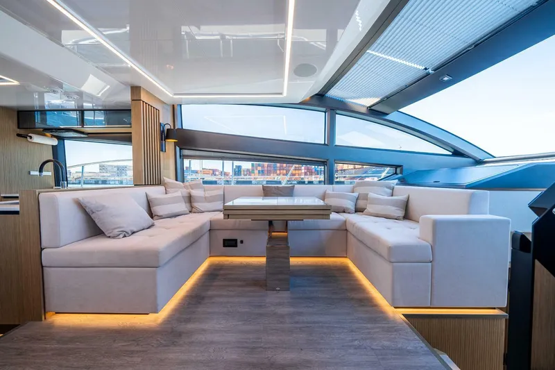  Yacht Photos Pics Luxurious interior of 2023 Pearl 62 yacht with modern seating and ambient lighting.