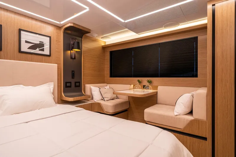  Yacht Photos Pics Luxurious interior of 2023 Pearl 62 yacht with modern design and cozy seating area.