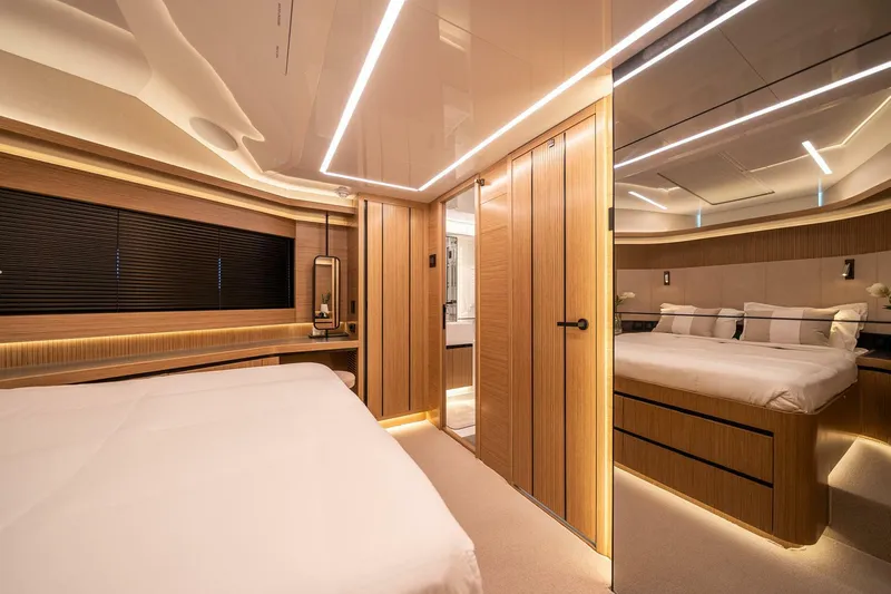  Yacht Photos Pics Luxurious interior of 2023 Pearl 62 yacht, featuring modern wood paneling and ambient lighting.