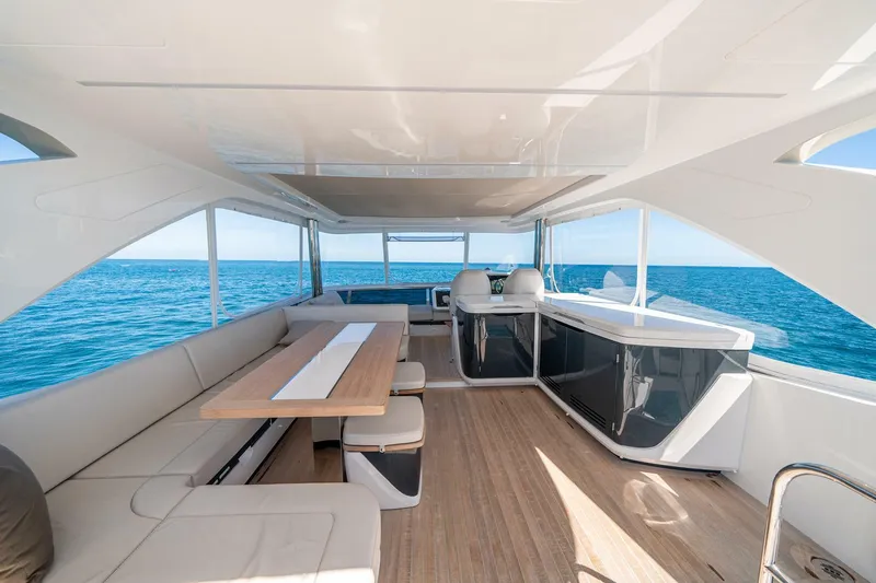  Yacht Photos Pics Luxurious interior of 2023 Pearl 62 yacht with ocean view and modern seating.