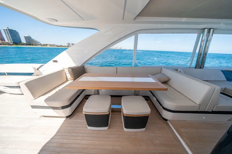  Yacht Photos Pics Luxurious Pearl 62 yacht interior with elegant seating and ocean view, 2023 model.
