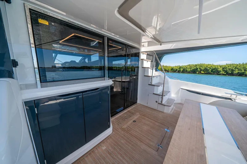  Yacht Photos Pics Luxurious Pearl 62 yacht interior, featuring sleek design and scenic water views, 2023 model.