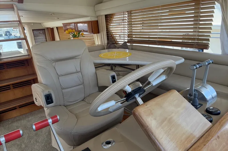  Yacht Photos Pics Luxurious 2003 Navigator 53 yacht interior with leather seating and wooden accents.