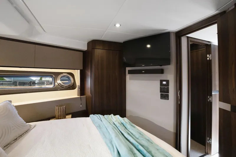 Yacht Photos Pics Luxurious bedroom interior of 2019 Azimut 50 Fly yacht with modern amenities.