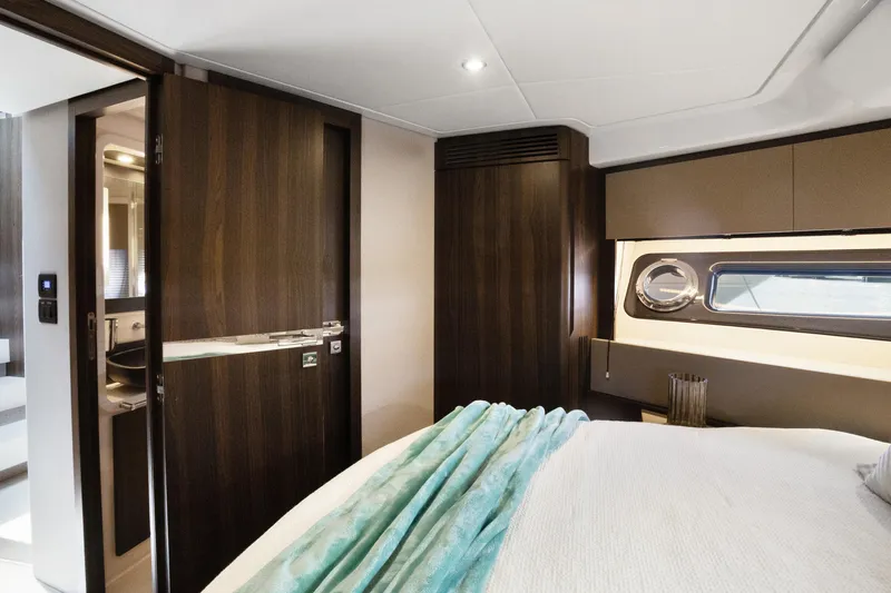  Yacht Photos Pics Luxurious interior of 2019 Azimut 50 Fly yacht with modern bedroom and ensuite bathroom.