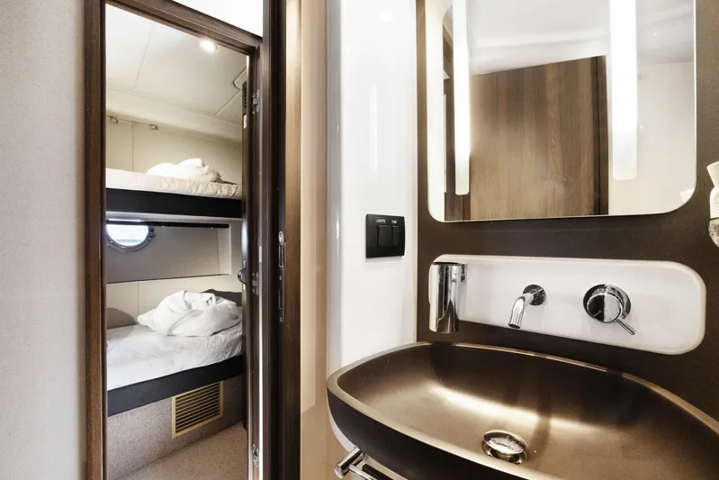  Yacht Photos Pics Luxurious 2019 Azimut 50 Fly yacht interior with modern bathroom and cozy bunk beds.