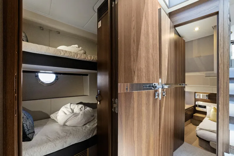  Yacht Photos Pics Interior of 2019 Azimut 50 Fly yacht with cozy bunk beds and wooden cabinetry.