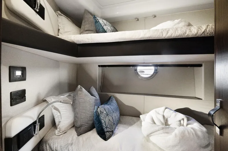  Yacht Photos Pics Luxurious cabin interior of 2019 Azimut 50 Fly yacht with cozy bunk beds.
