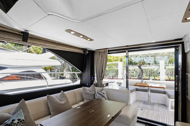  Yacht Photos Pics Luxurious interior of 2019 Azimut 50 Fly yacht with elegant seating and dining area.