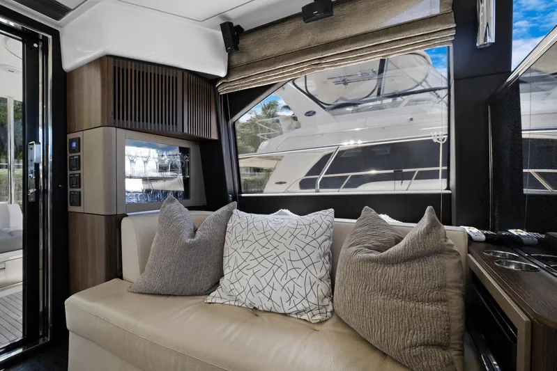  Yacht Photos Pics Luxurious interior of 2019 Azimut 50 Fly yacht with plush seating and elegant decor.