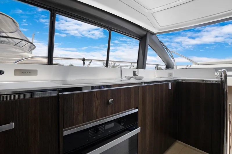  Yacht Photos Pics Luxurious interior of 2019 Azimut 50 Fly yacht with modern kitchen design.