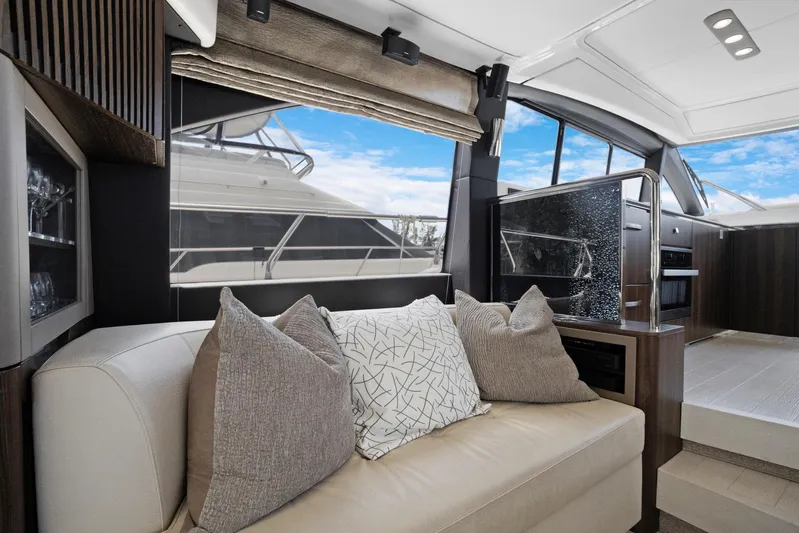  Yacht Photos Pics Luxurious interior of 2019 Azimut 50 Fly yacht with modern seating and elegant decor.