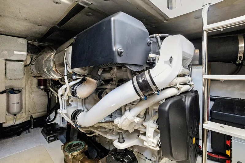  Yacht Photos Pics Engine room of 2019 Azimut 50 Fly yacht, showcasing complex machinery and components.