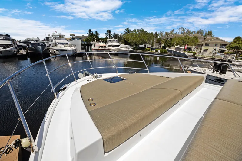  Yacht Photos Pics 2019 Azimut 50 Fly yacht with sunbathing area, docked in a marina.