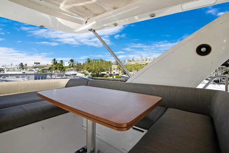  Yacht Photos Pics Luxurious seating area on 2019 Azimut 50 Fly yacht with marina view.