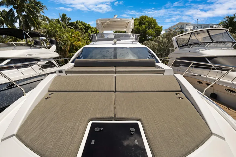  Yacht Photos Pics 2019 Azimut 50 Fly yacht with spacious sun deck, docked among palm trees.