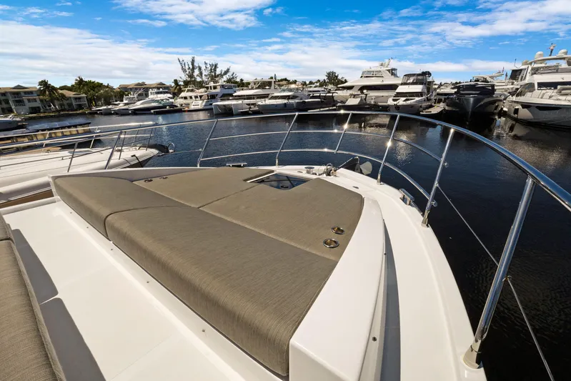  Yacht Photos Pics 2019 Azimut 50 Fly yacht with sun deck, docked in a marina under blue skies.