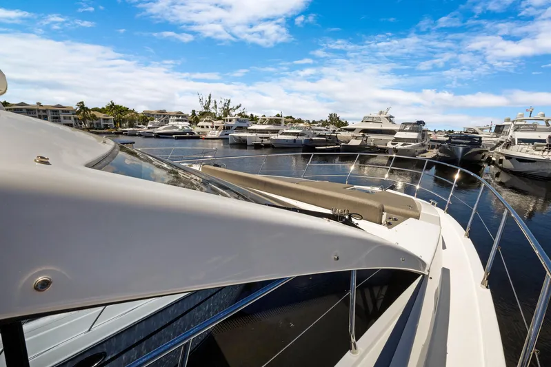  Yacht Photos Pics 2019 Azimut 50 Fly yacht docked in a marina under a clear blue sky.
