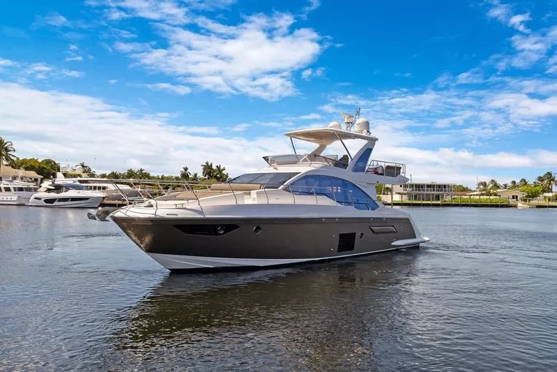  Yacht Photos Pics 2019 Azimut 50 Fly yacht cruising on a sunny day with blue skies.