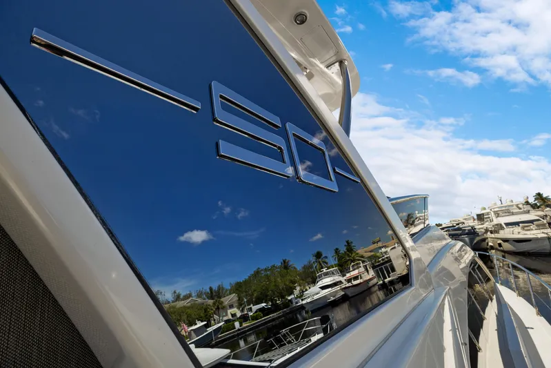  Yacht Photos Pics Azimut 50 Fly 2019 yacht reflecting marina, under clear blue sky.