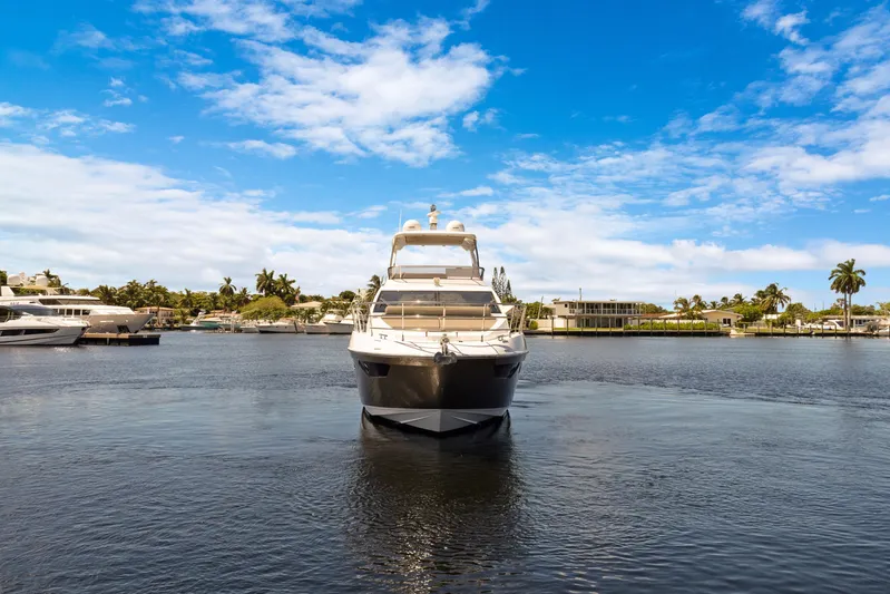  Yacht Photos Pics 2019 Azimut 50 Fly yacht on calm water under a clear blue sky.