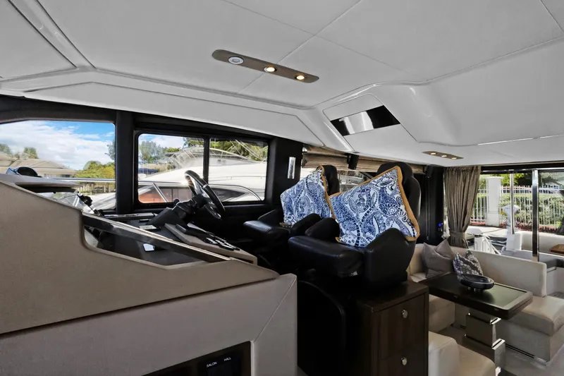  Yacht Photos Pics Luxurious interior of 2019 Azimut 50 Fly yacht with elegant seating and helm station.