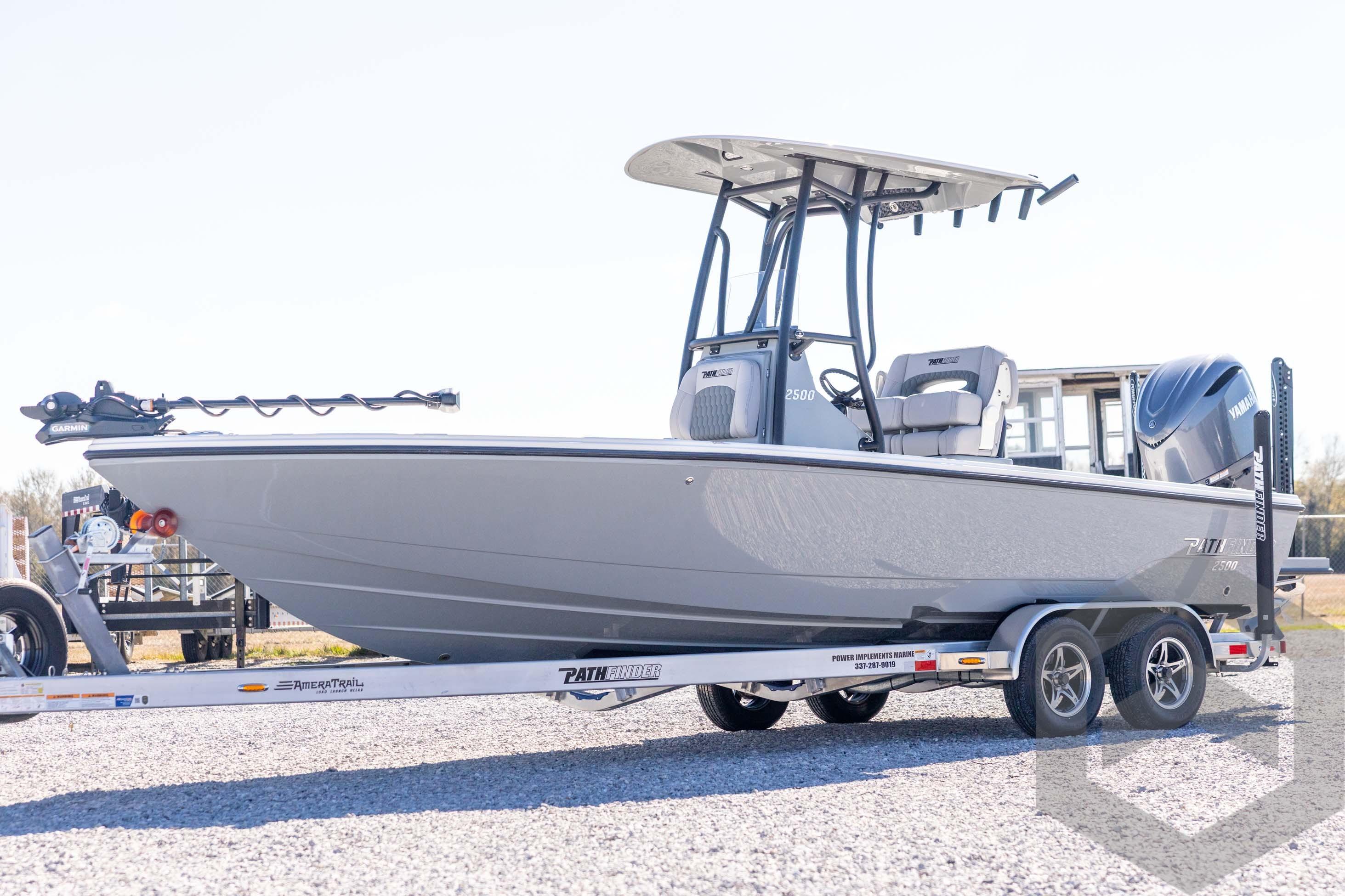 2026 Pathfinder 2500 Hybrid boat on trailer, sleek design, outdoor setting.