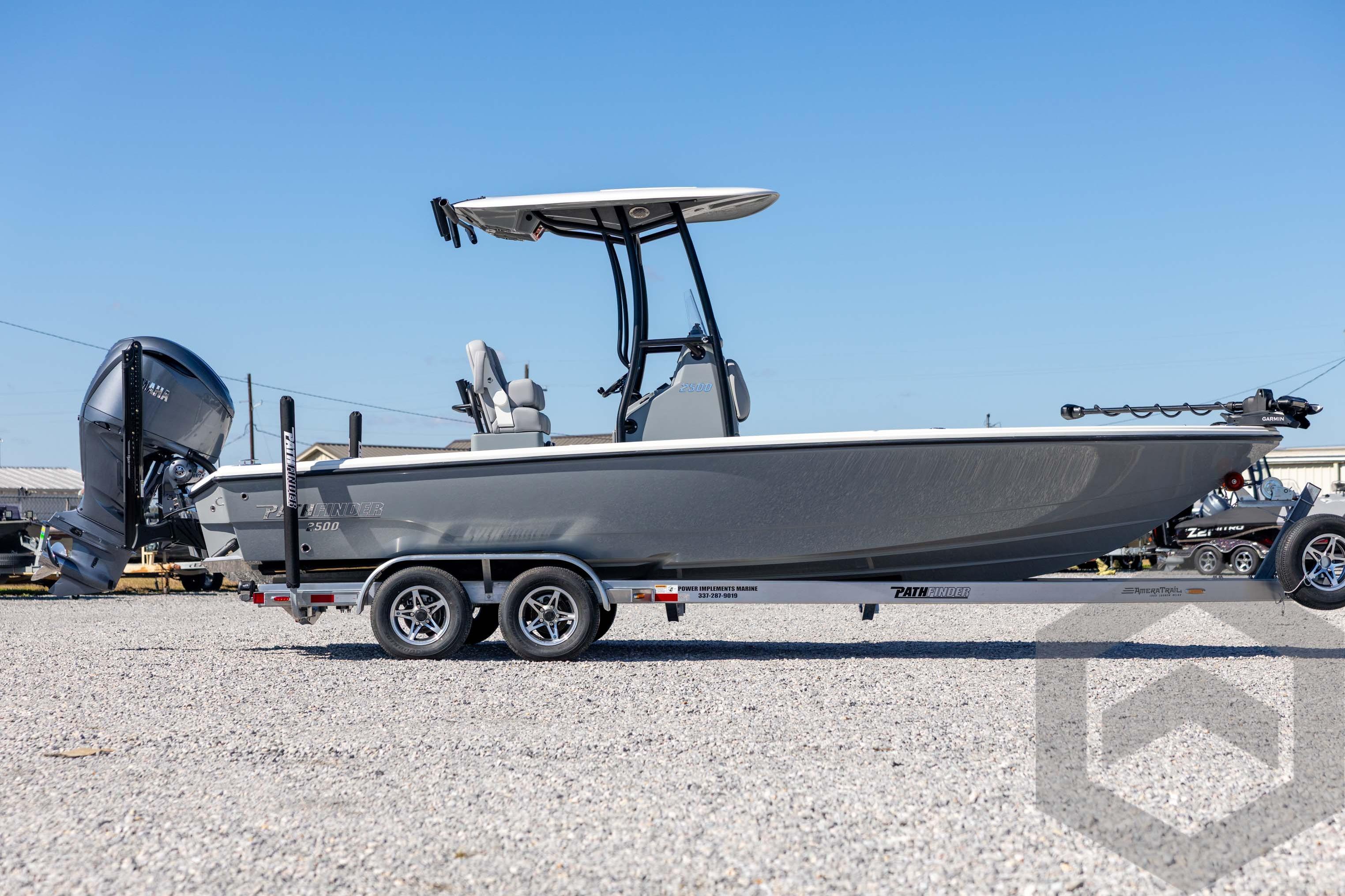 2026 Pathfinder 2500 Hybrid boat on trailer, side view, outdoors.